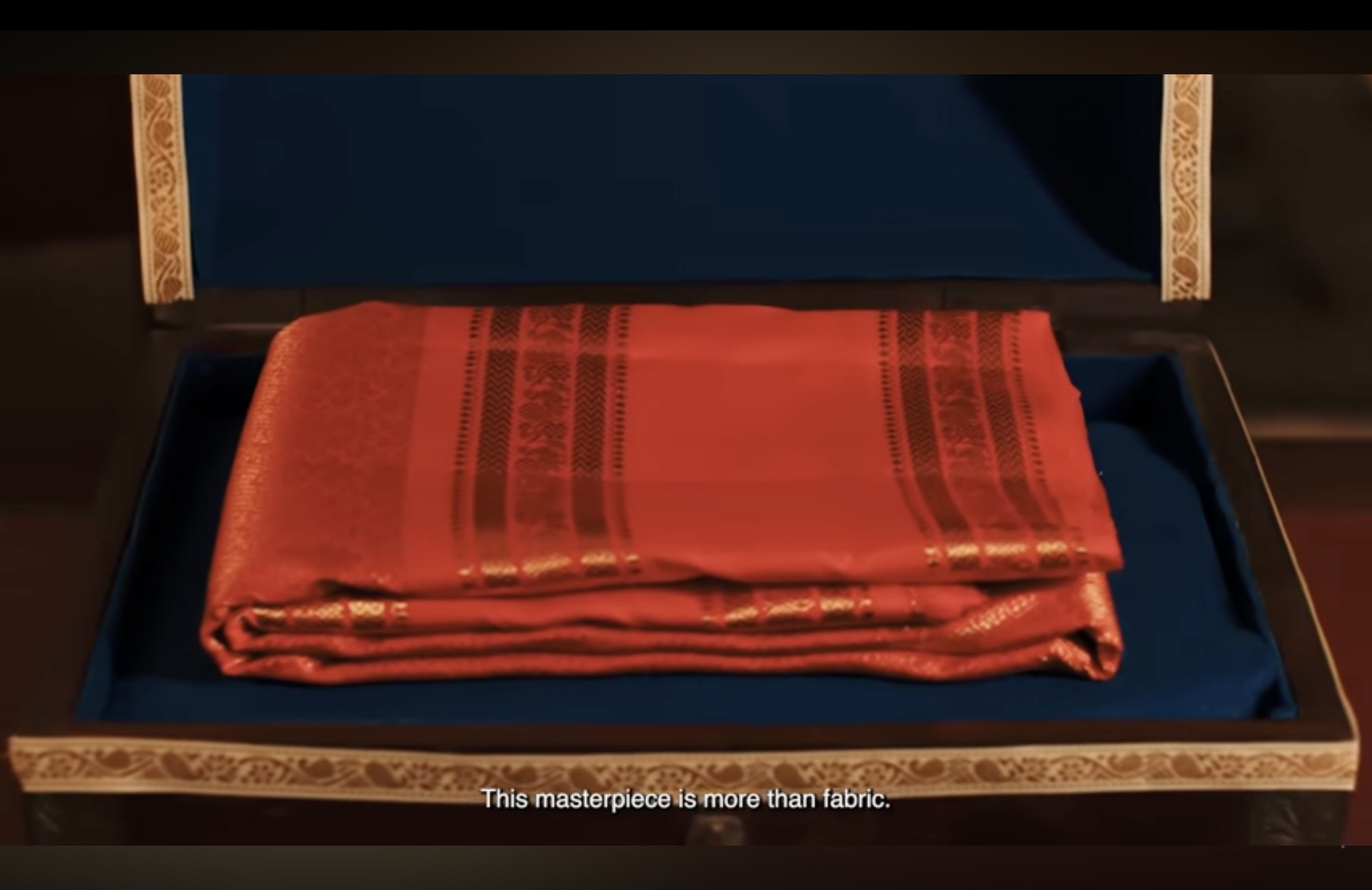 A saree resting in a wooden trunk, from the 105th-year film
